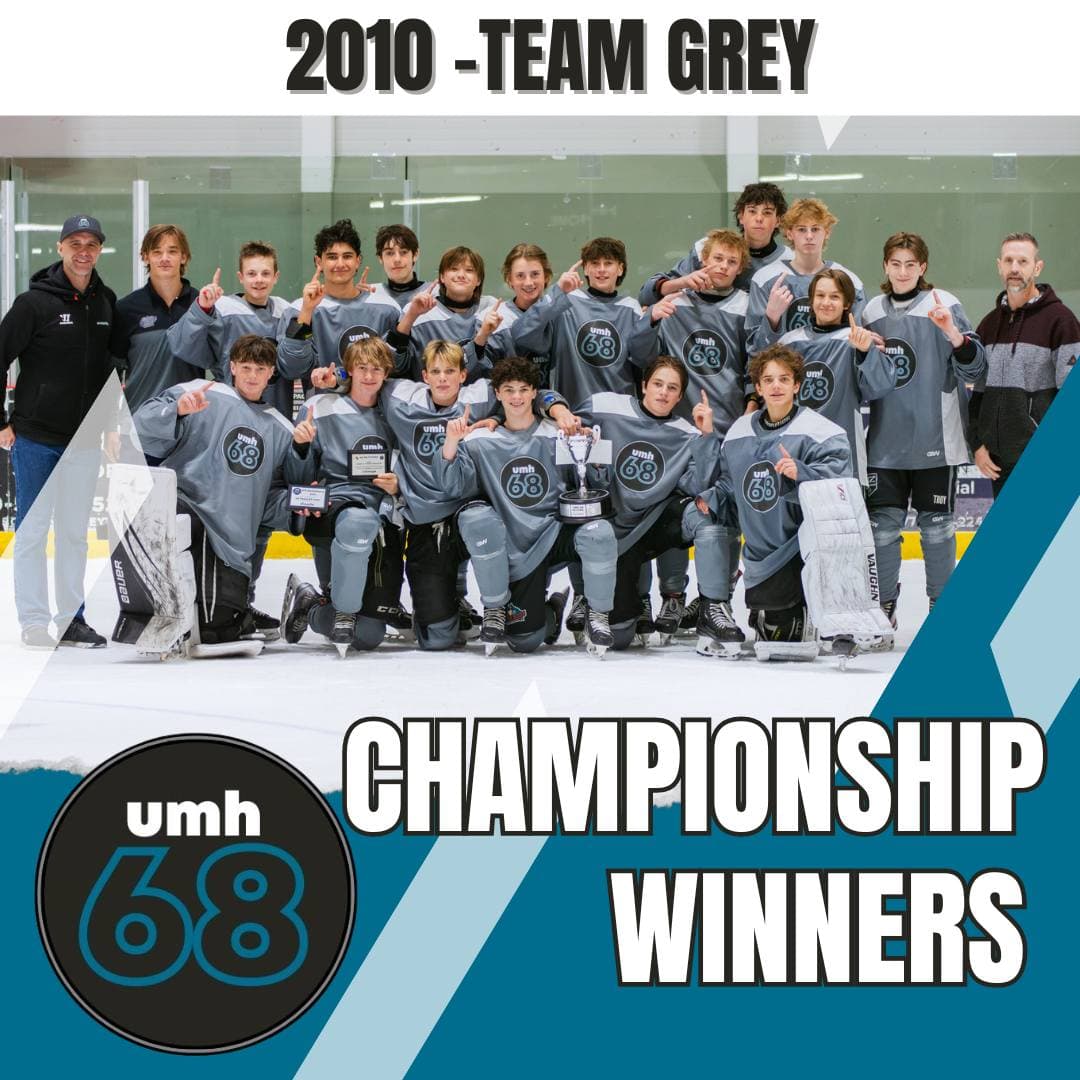 2010 born Team Grey posing with their championship trophy